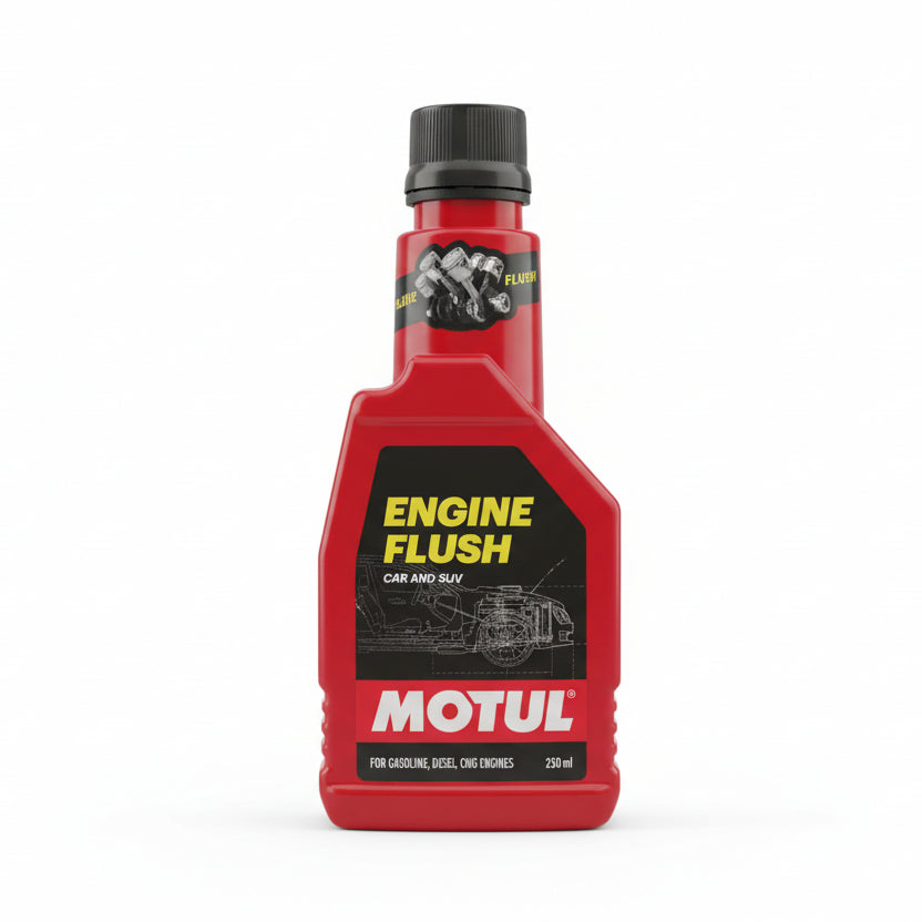 Red bottle of Motul Engine Flush held in a hand with a blurred store background - www.biker.store